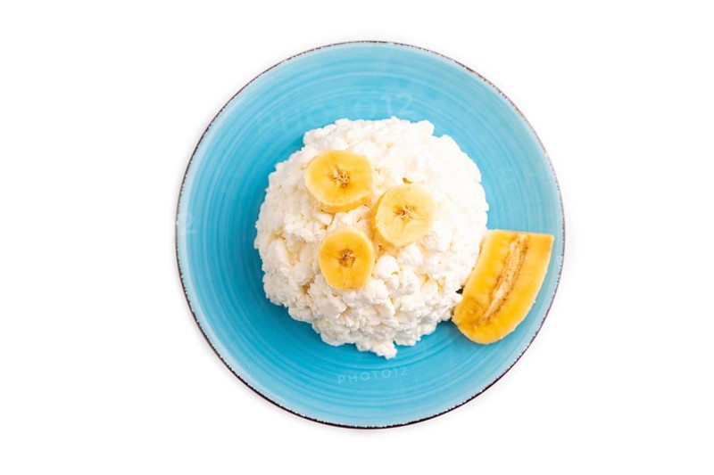 White ?ottage cheese, Curd, with Banana isolated on white background, top view, flat lay, close up