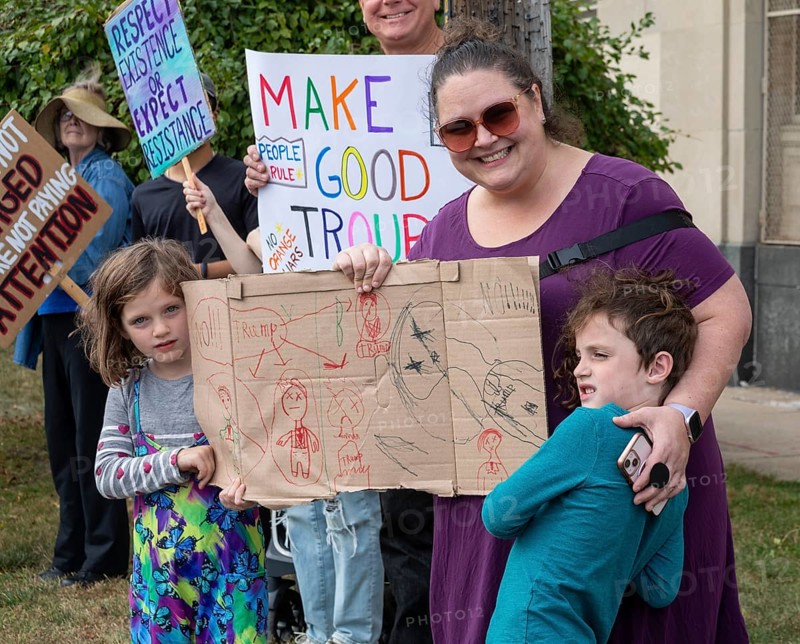 Detroit, Michigan USA - 18 October 2025 - Protesters from Detroit and Grosse Pointe gathered on the border between their cities for a 'No Kings' rally, protesting President Trump's actions against immigrants and against democratic institutions