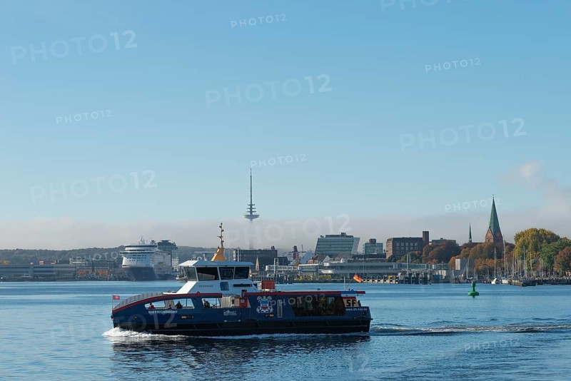 Kiel port, liner Dietrichsdorf on the fjord and Kiel-Oslo ferry on the east shore quay, ferry and crusader of the Color Line, radio tower, tower of St. Nikolai church, Swedish quay, marina, haze bell, Baltic Sea, Schleswig-Holstein, Germany