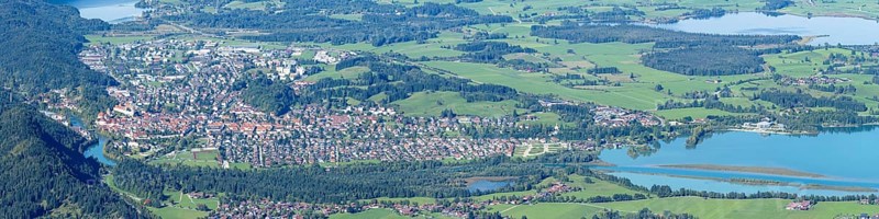 Panorama of Tegelberg, 1881m, on Füssen with historic old town, the Lech and behind it the Weissensee, on the right the Hopfensee and the Forggensee, Ostallgäu, Allgäu, Bavaria, Germany