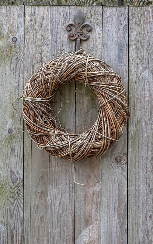 Door wreath made of natural materials on a wooden wall, North Rhine-Westphalia, Germany