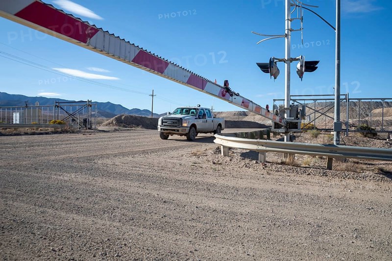 Round Mountain, Nevada - The Round Mountain Gold Mine, an open pit mine operated by Kinross Gold. The mine uses railroad-like crossing guards to block access at mine roads