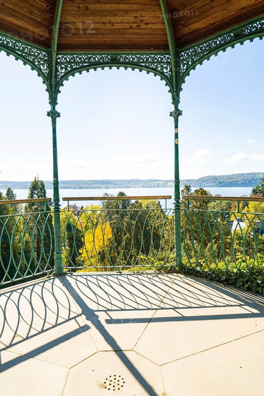 Metal pavilion with view of lake and forests under bright skies, Überlingen, Lake Constance, Germany