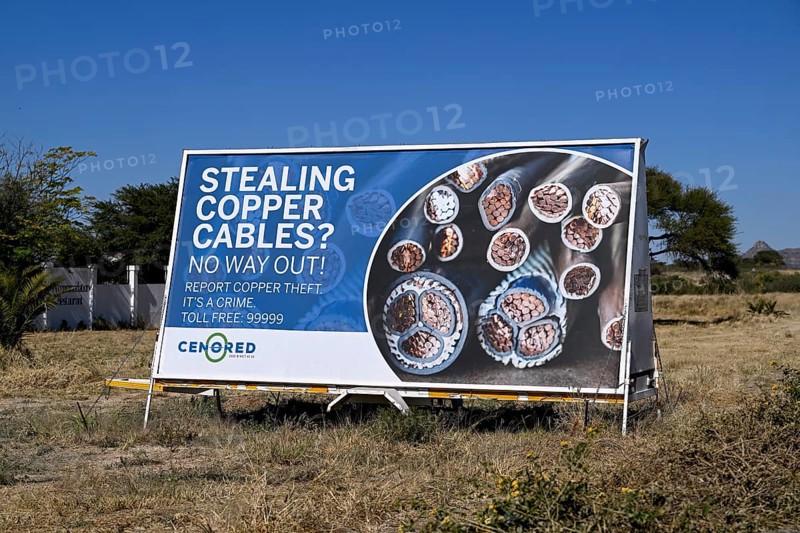 Warning sign for stealing copper cables, Otjiwarongo, Otjozondjupa region, Namibia