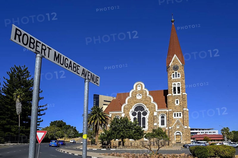 Robert Mugabe Avenue sign in front of the 1910 Evangelical Lutheran Christ Church, Windhoek, Khomas region, Namibia