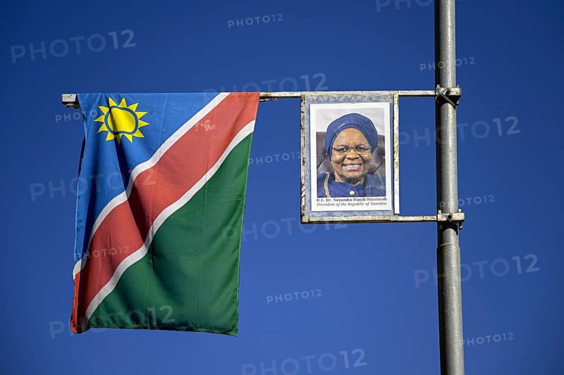 Namibian flag and image of President Dr. Netumbo Nandi-Ndaitwah on a street lamp, Windhoek, Khomas region, Namibia
