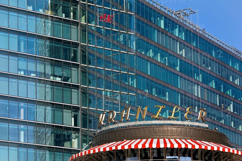 Historic Café Kranzler logo with modern office building and H&M logo on Kurfürstendamm, Charlottenburg, Berlin, Germany