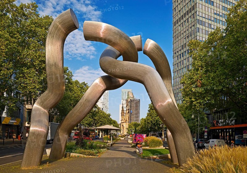 The sculpture entitled Berlin by Brigitte and Martin Matschinsky-Denninghoff with Kaiser Wilhelm Memorial Church, Charlottenburg, West Berlin, Berlin, Germany