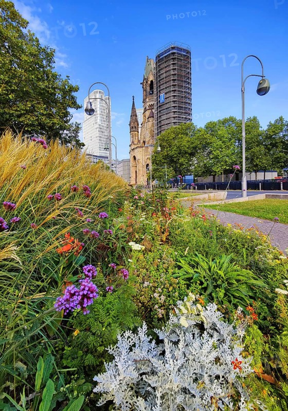 Planted middle strip of Tauentzienstraße with Kaiser Wilhelm Memorial Church, promenade, Charlottenburg, Berlin, Germany
