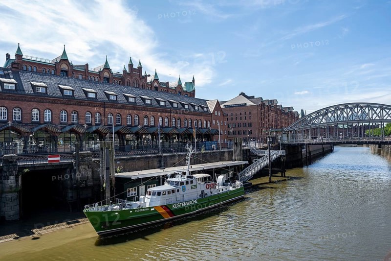 Customs Canal with Kornhaus Bridge, German Customs Museum and Coast Guard Boat, Speicherstadt, Hamburg, Germany