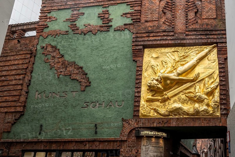 Entrance to Böttcherstraße, golden relief, façade relief The Light Bringer by Roland Hötger, Old Town, Bremen, Germany