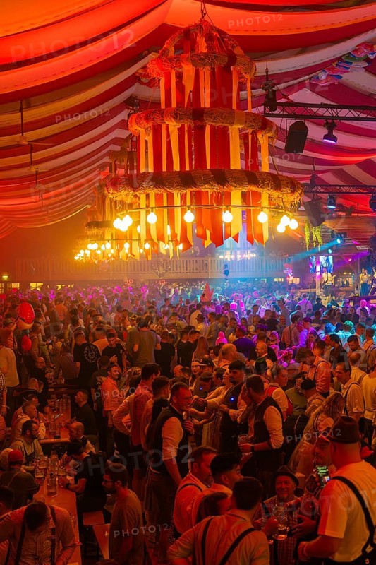 Large crowd celebrates in the festive light of a beautifully decorated marquee, Cannstatter Wasen folk festival, Sonja Merz marquee, Stuttgart, Germany