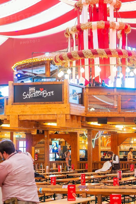 Bar area in a festively decorated beer tent with red ceilings and wooden elements, Volksfest Cannstatter Wasen, Sonja Merz Festzelt, Stuttgart, Germany