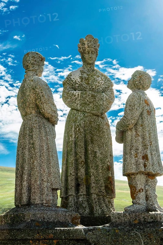 Statue of Virgin Mary and children. Roc de Courlande in Auvergne Volcanoes Regional Park. Puy de Dome. Auvergne Rhone Alpes. France