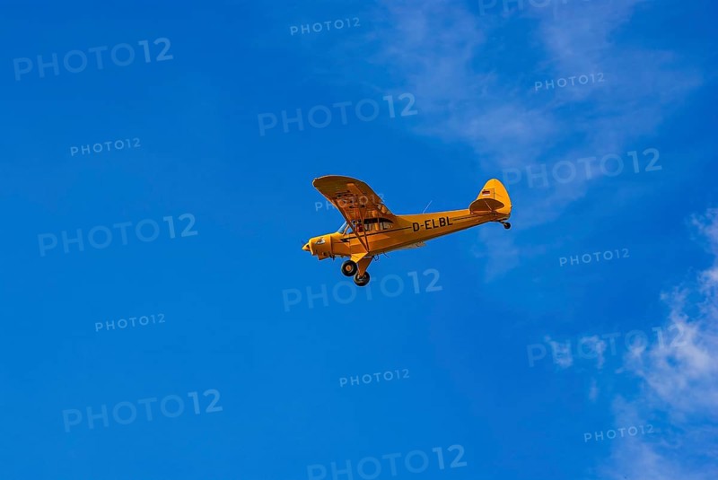 A Piper PA-18 Super Cub of the Bravo Lima Formation during a flight demonstration as part of an air show at the Rossfeld in Metzingen-Glems, Baden-Württemberg, Germany, for editorial use only