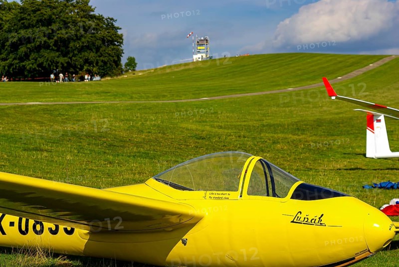 A Letov LF-107 Lunak glider with the registration OK-0833 parked at the edge of the airfield during an air show at Rossfeld in Metzingen-Glems, Baden-Württemberg, Germany, for editorial use only