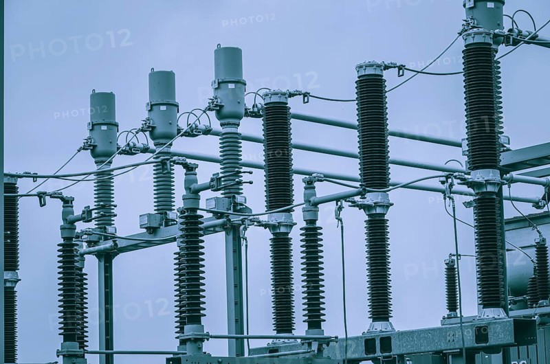 Concept of electricity and power generation using the example of insulators and devices in a substation