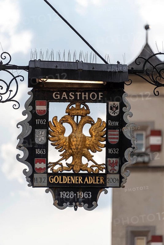 Traditional inn sign, Gasthof Goldener Adler in the historic centre of Innsbruck, Tyrol, Austria