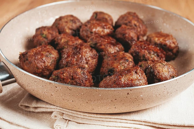 Fried meatballs in a frying pan, homemade, no people
