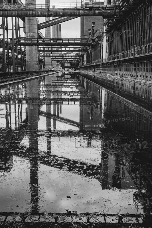 Zollverein coking plant, coke oven batteries, belt bridges and chimneys are reflected, water basin, black and white photo, UNESCO World Heritage Site, Essen, Ruhr area, North Rhine-Westphalia, Germany