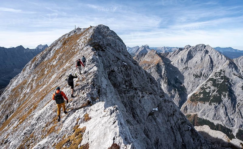 Mountain panorama, group of mountaineers on the ridge of the Gamsjoch, transition to the main summit of the Gamsjoch, western summit with summit cross behind, in autumn, Rißtal in the Eng, Karwendel, Tyrol, Austria