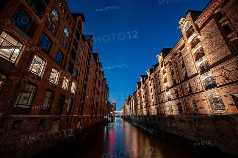 Illuminated warehouses in Hamburg's Speicherstadt, blue hour, Hamburg, Germany