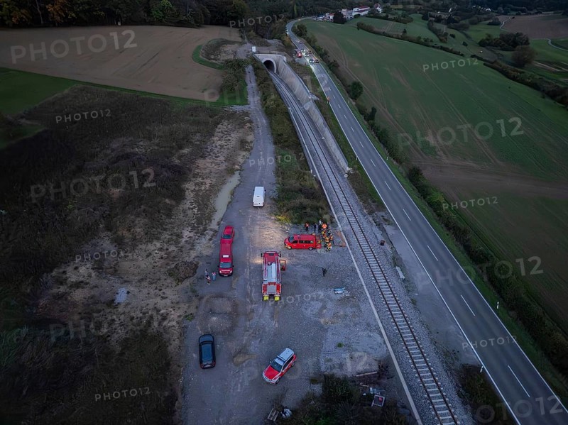 Aerial view of an operation site on railway tracks and roads with fire engines, fire drill in the new tunnel of the Hermann Hesse railway, Ostelsheim, district of Calw, Germany