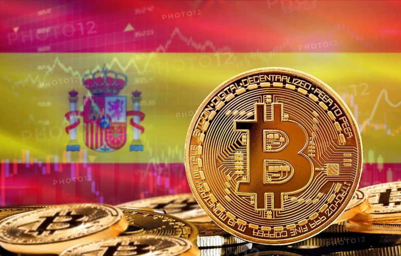 Investors in cryptocurrency and Blockchain Technology in Spain, Concept. Bitcoin with Spain flag in the background