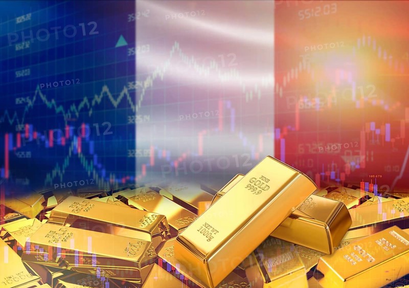 Gold bars on France flag in background. Gold bars stacked on French flag. Concept of France gold reserves