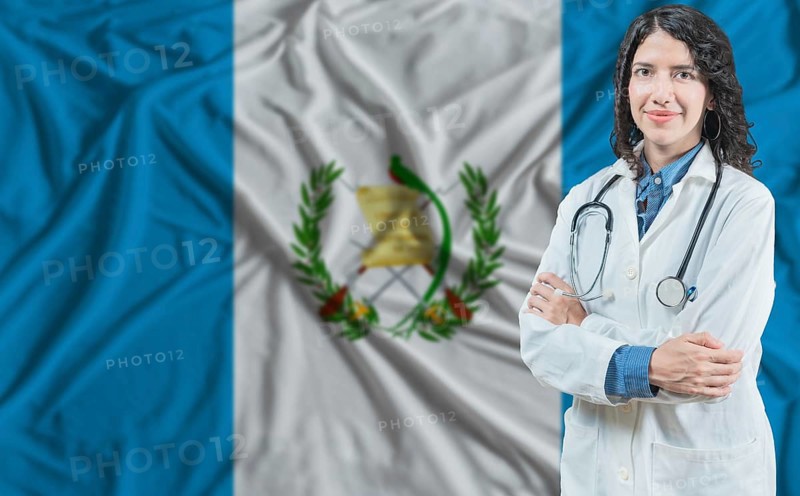 Guatemalan medicine and healthcare concept. Doctor close up against Guatemala flag background