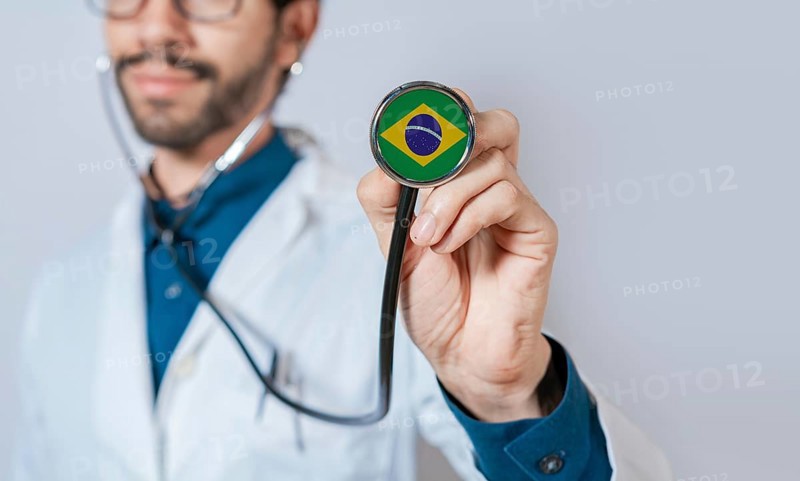 Doctor holding stethoscope with Brazil flag. Brazil health and care concept. Brazil flag on stethoscope