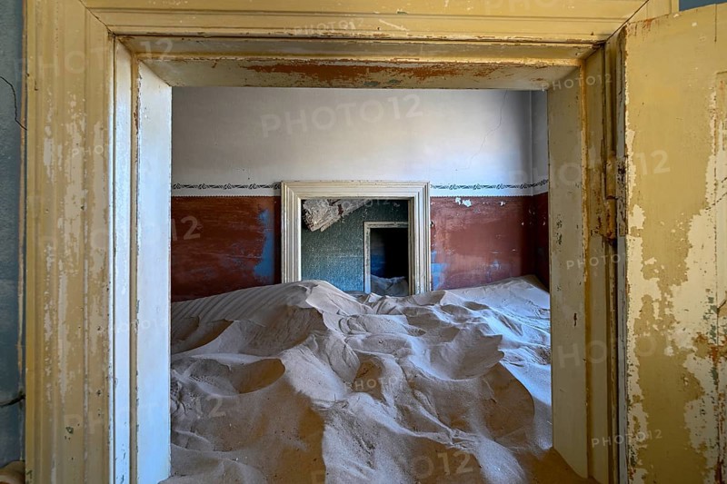 Sand mountains in a former dwelling house, interior photograph, Kolmanskop, restricted diamond area, near Lüderitz, Karas region, Namibia