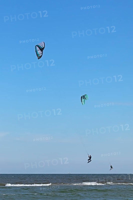 Two kitesurfers jumping, Baltic Sea, Falshöft, Pommerby, Schleswig-Holstein, Germany