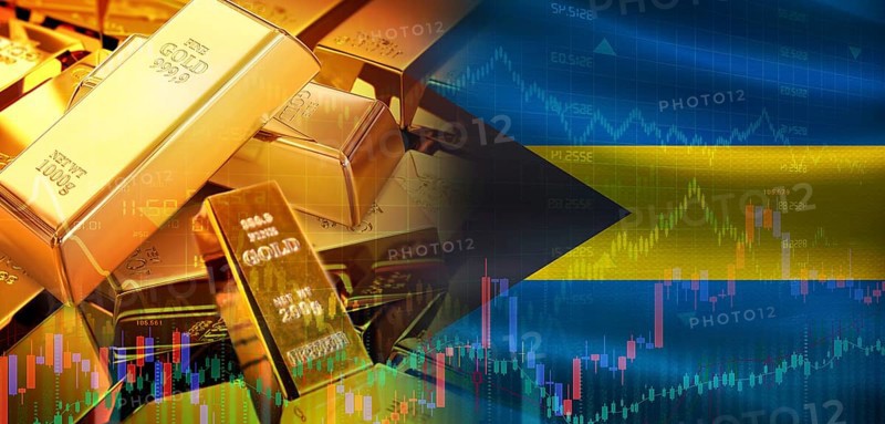 Gold bars stacked on Bahamian flag. Bahamas gold reserves, Concept