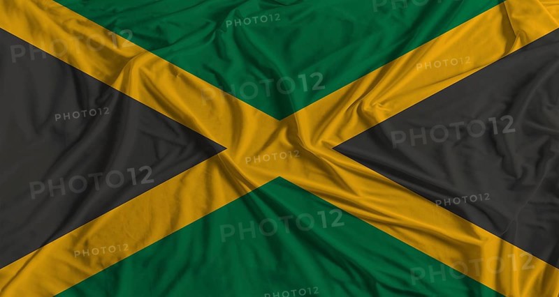 Jamaican flag with fabric texture background. National flag of Jamaica