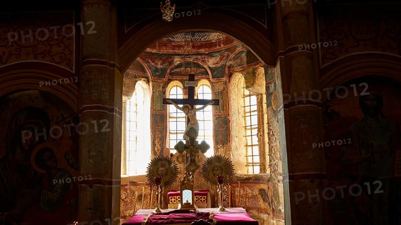 Metropolis, Metropolitan Church of Agios Dimitrios Mystras, An atmospheric church interior with a cross and icons in front of bright windows, Mystras, Mistra, UNESCO World Heritage Site, Medieval Byzantine ruined city, north-west of Sparta, foothills of the Tyagetos Mountains, Peloponnese, peninsula, Greece
