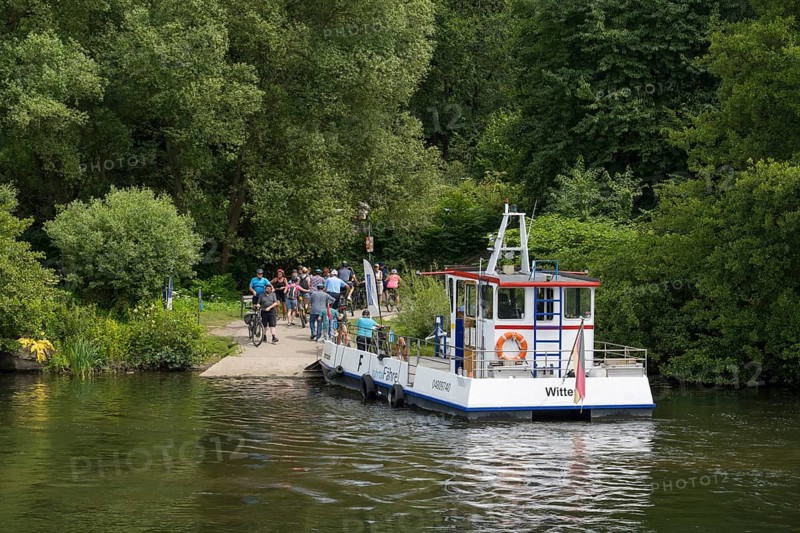 People at the Ruhr Valley ferry, Hardenstein Castle pier on the Ruhr, Herbede, Witten, Ruhr area, North Rhine-Westphalia, Germany