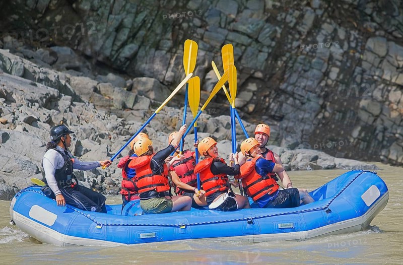 People celebrating white water rafting adventure, Costa Rica, Central America