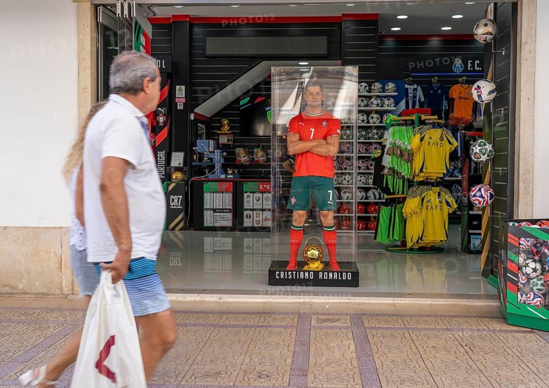 Sports shop, sells merchandise of the Portuguese national football team, various other local football clubs, life-size figure of football star Christiano Ronaldo, CR7, in Vila Real de Santo António, on the border with Spain, Algarve, Portugal