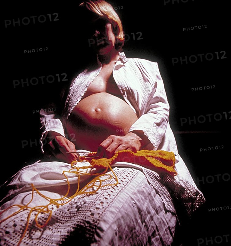 Pregnant woman with knitting, Bavaria, Germany