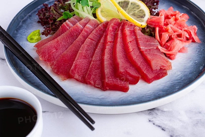 Tuna sashimi, with side dish, on a marble table, homemade, no people