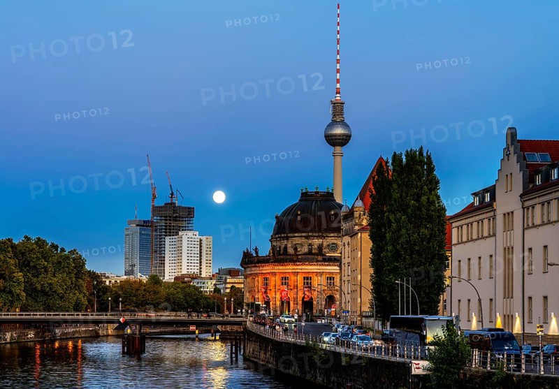View from the Weidendammer Bridge to the television tower and the Bode Museum, evening light with full moon on the skyline, Berlin, Germany
