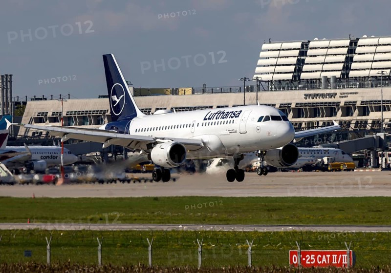 Flight operations at Stuttgart Airport with terminal. Aircraft on landing. Aircraft registration number: D-AILM, Lufthansa, Airbus A319-100, Stuttgart, Baden-Württemberg, Germany