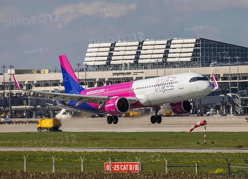 Flight operations at Stuttgart Airport with terminal. Aircraft on landing. Aircraft registration number: HA-LGR, Wizz Air, Airbus A321neo. Stuttgart, Baden-Württemberg, Germany