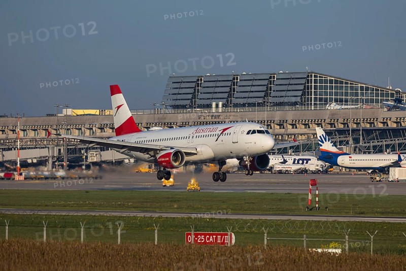 Flight operations at Stuttgart Airport with terminal. Aircraft landing. Aircraft registration: OE-LBR Austrian Airlines Airbus A320-200. Stuttgart, Baden-Württemberg, Germany
