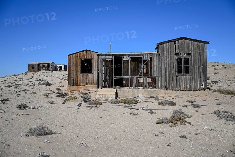Dilapidated building in the desert sand, Pomona, restricted diamond area, near Lüderitz, Karas region, Namibia