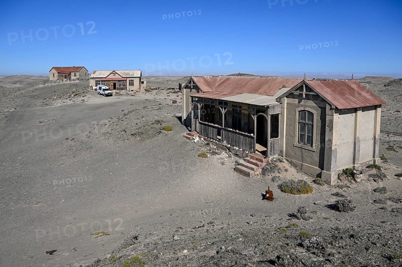 Ruined buildings in the desert sand, Pomona, restricted diamond area, near Lüderitz, Karas region, Namibia