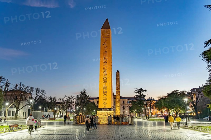 The Ancient Egyptian Obelisk of Theodosius or Obelisk of Istanbul and the Column of Constantine or Masonry Obelisk on the Hippodrome in Istanbul at dusk, Turkey