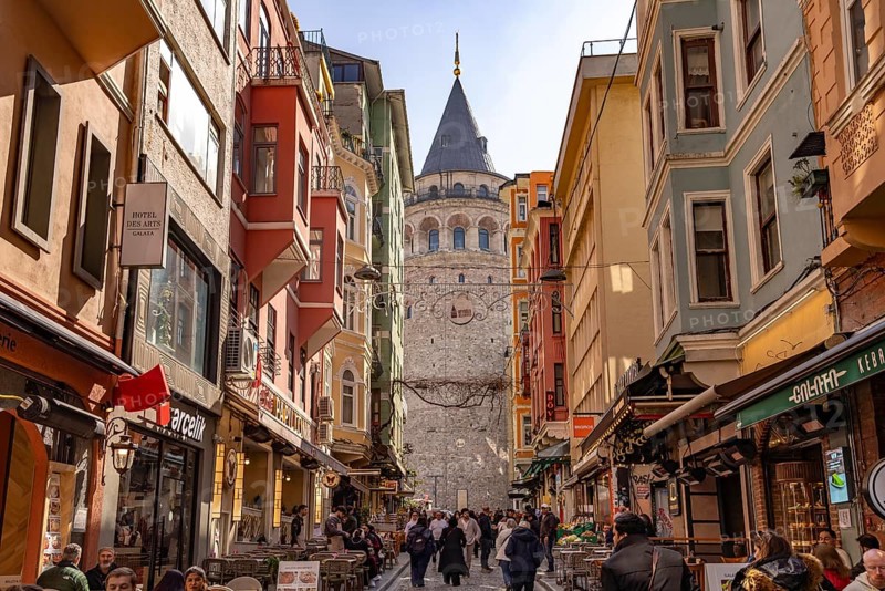 Shops, restaurants and the Galata Tower in Beyoglu, Istanbul, Turkey