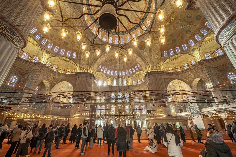 Visitors to the Blue Mosque or Sultan Ahmed Mosque in Istanbul, Turkey
